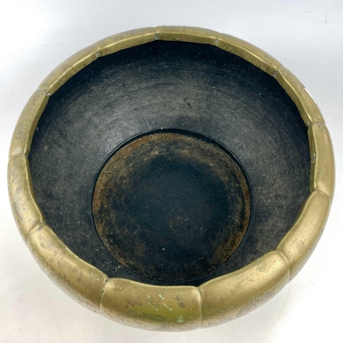 281 - A large brass Chinese floriform jardiniere decorated with dragons and clouds, diameter 42cm.