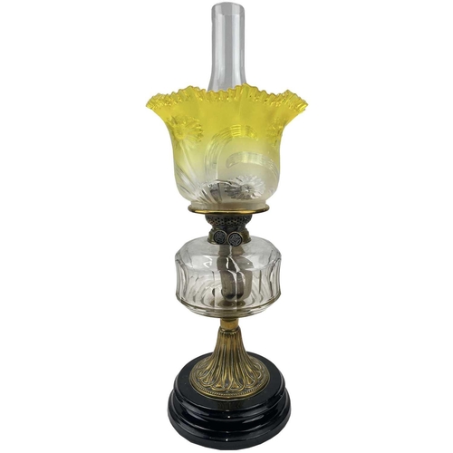 29 - A Victorian glass and brass oil lamp, with a graduated yellow glass shade and fitted a Pasley burner... 