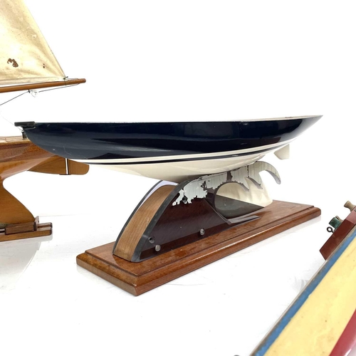 290 - A 20th century fully rigged pond yacht with stand, height 107cm, together with another two pond yach... 