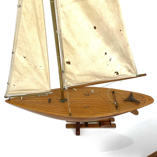 290 - A 20th century fully rigged pond yacht with stand, height 107cm, together with another two pond yach... 