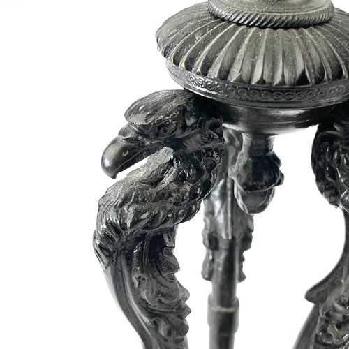 3 - A pair of Bronze candlesticks, mid 19th century, each with a removable sconce and raised upon triple... 