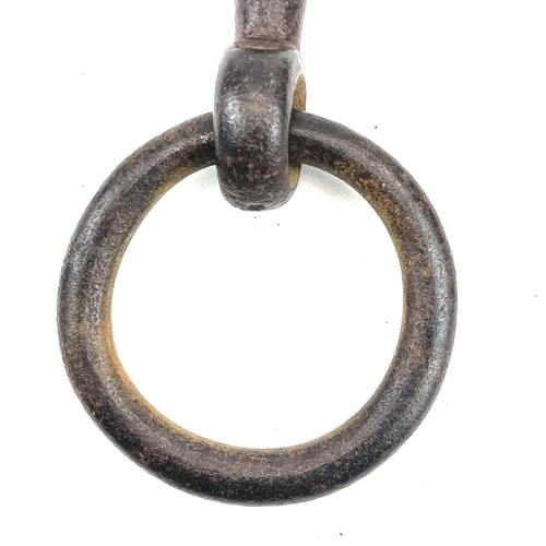 32 - An 18th century iron key, with integral folding ring, length 15cm, together with three other iron ke... 