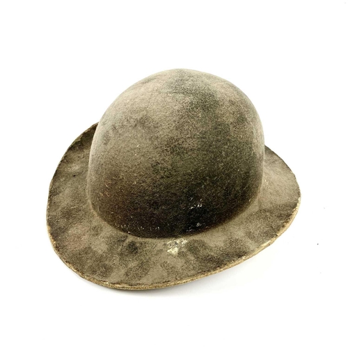 341 - A 19th century leather mining helmet of bowl form with wide brim, height 14cm.