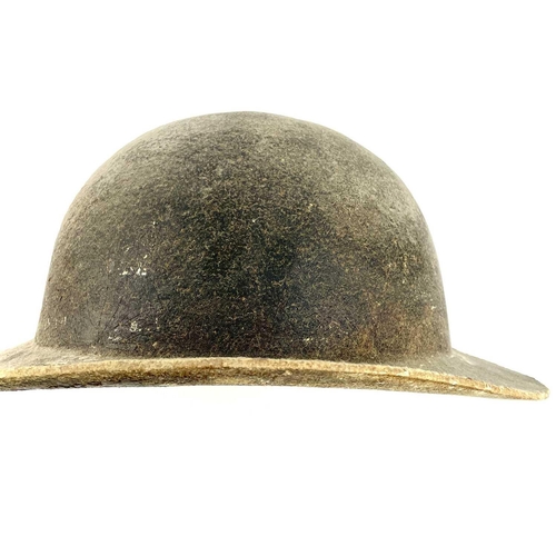 341 - A 19th century leather mining helmet of bowl form with wide brim, height 14cm.