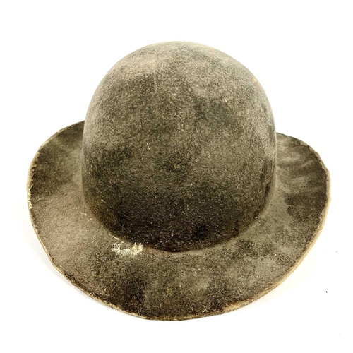 341 - A 19th century leather mining helmet of bowl form with wide brim, height 14cm.