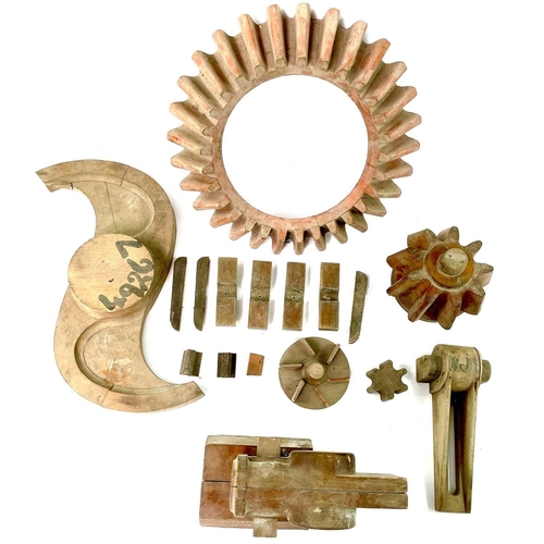 354 - An N. Holman & Sons Ltd wood patterns used in sand casting including two cogs, and a crosshead for a... 