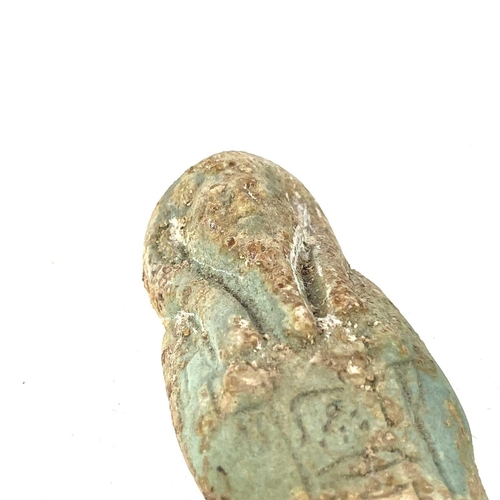 39 - An ancient Egyptian pottery shabti possibly 1570BC-945BC with traces of glaze, length 11cm together ... 