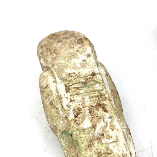 39 - An ancient Egyptian pottery shabti possibly 1570BC-945BC with traces of glaze, length 11cm together ... 