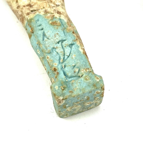 39 - An ancient Egyptian pottery shabti possibly 1570BC-945BC with traces of glaze, length 11cm together ... 