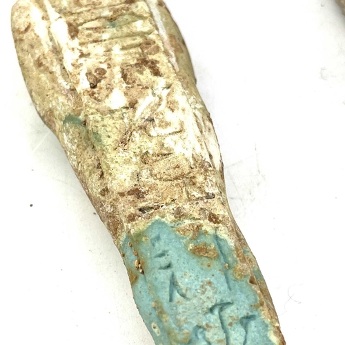 39 - An ancient Egyptian pottery shabti possibly 1570BC-945BC with traces of glaze, length 11cm together ... 