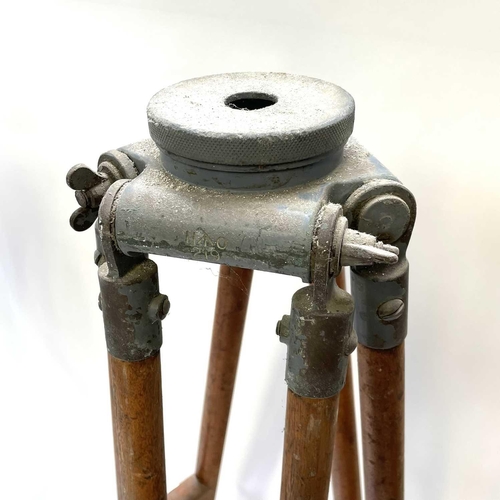 390 - A 20th century theodolite tripod stand with metal mounts and impressed broad arrow mark, height 164c... 