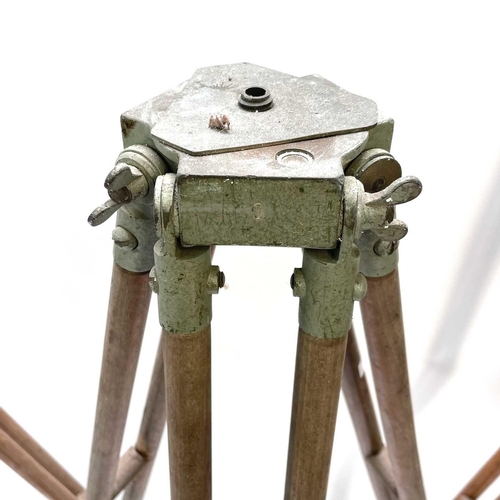 390 - A 20th century theodolite tripod stand with metal mounts and impressed broad arrow mark, height 164c... 