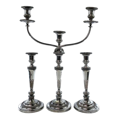 4 - Old Sheffield plate. A Candelabrum and a pair of candlesticks . Early 19th century, of neo-classical... 