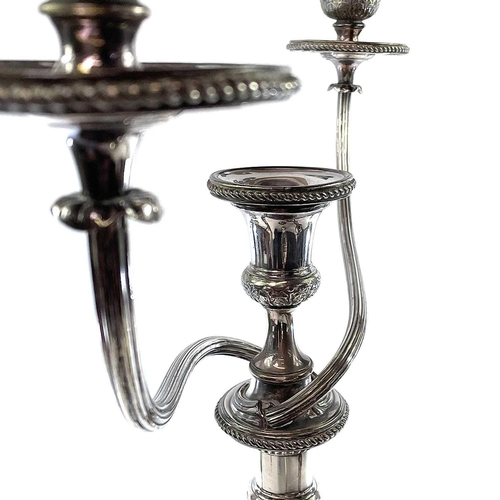 4 - Old Sheffield plate. A Candelabrum and a pair of candlesticks . Early 19th century, of neo-classical... 