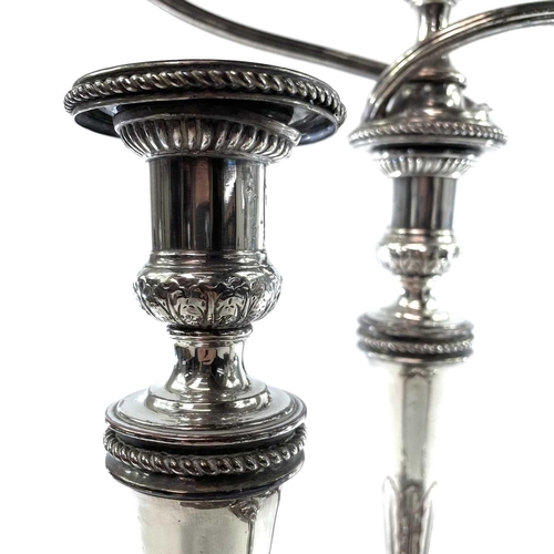 4 - Old Sheffield plate. A Candelabrum and a pair of candlesticks . Early 19th century, of neo-classical... 