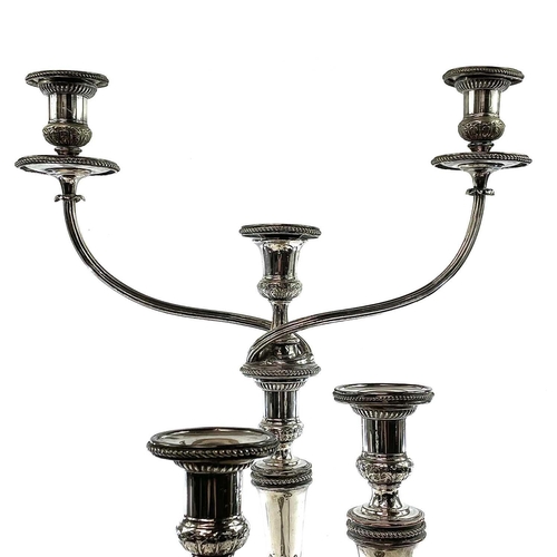 4 - Old Sheffield plate. A Candelabrum and a pair of candlesticks . Early 19th century, of neo-classical... 