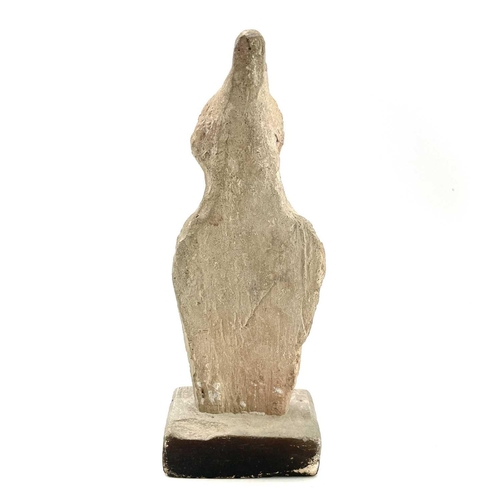 40 - A Cypriot limestone half length votive figure carved with a conical headdress on square plaster base... 