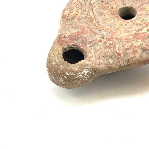 41 - A Roman terracotta oil lamp moulded with wheat design diameter 10cm together with another Roman terr... 