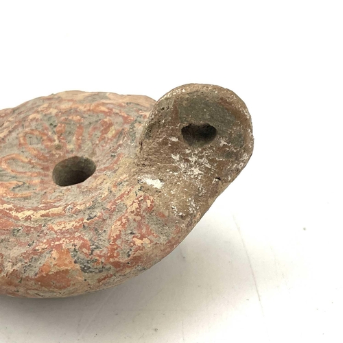 41 - A Roman terracotta oil lamp moulded with wheat design diameter 10cm together with another Roman terr... 