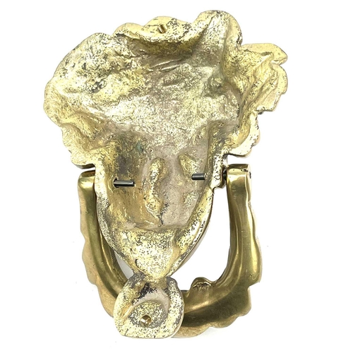 53 - A brass door knocker modelled as a Classical female mask, height 17cm.