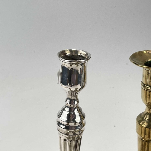 54 - A George III paktong candlestick, of neo-classical form with a tapered fluted column, height 25cm, t... 