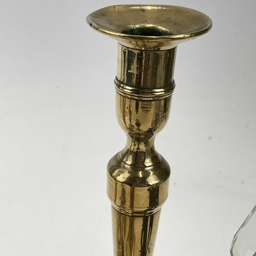 54 - A George III paktong candlestick, of neo-classical form with a tapered fluted column, height 25cm, t... 