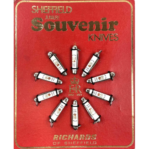 55 - A retailers display board of ten Richards of Sheffield 1977 silver jubilee souvenir folding pocket o... 