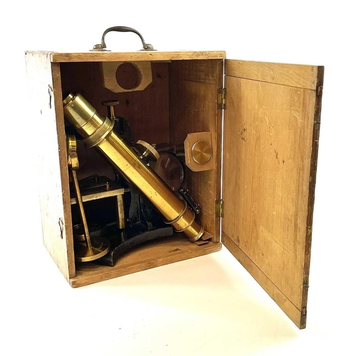 57 - A brass and painted metal microscope, circa 1900, with additional lens and viewer, height 39cm, in a... 