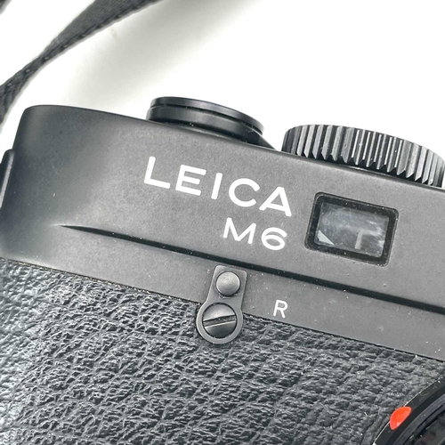 58 - A Leica M6 TTL black serial number 2497046 1999 with a Leica ELMAR-M 1:2. 8/50 E39 3727117 lens, Lei... 