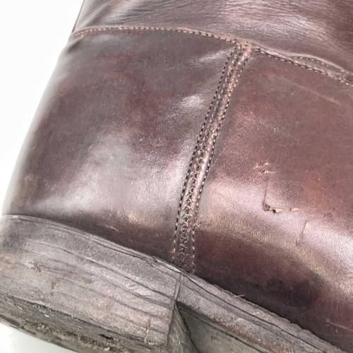 59 - A pair of brown leather riding boots and trees, height of boots 40cm.