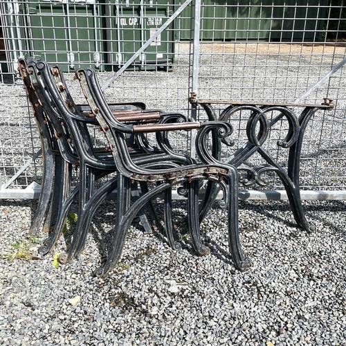 600 - Four pairs of cast iron bench ends and a pair of cast iron table legs.