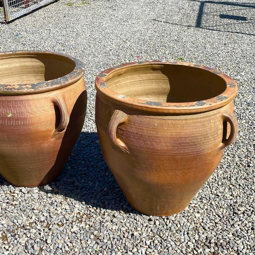 607 - A matched pair of large stoneware jardiniere with four lug handles, height 55cm diameter 63cm togeth... 