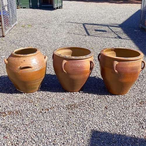 607 - A matched pair of large stoneware jardiniere with four lug handles, height 55cm diameter 63cm togeth... 