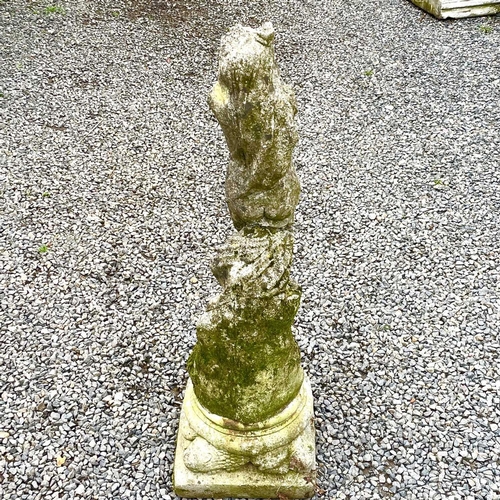 615 - A reconstituted stone figure of female a female nude on a separate moulded square base, overall heig... 