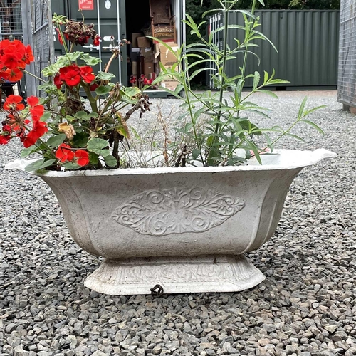 620 - Two Victorian cast iron shaped planters, the width of largest 67cm.