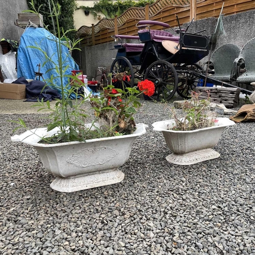 620 - Two Victorian cast iron shaped planters, the width of largest 67cm.