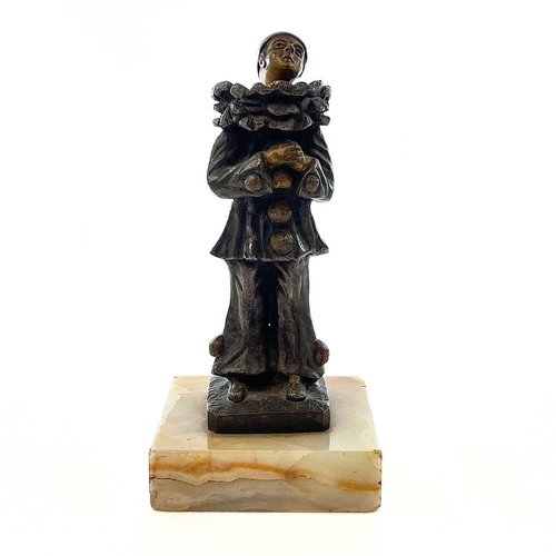 66 - E Benoit, A French Art Deco silvered bronze and gilt figure of Pierrot, on a square onyx base, heigh... 