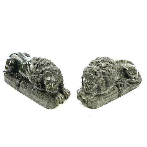 7 - After Canova, a pair of serpentine lions each in a recumbent pose, Italian, circa 1900, length 16cm.