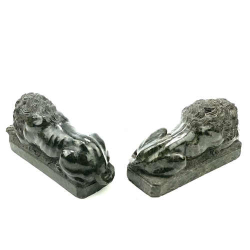 7 - After Canova, a pair of serpentine lions each in a recumbent pose, Italian, circa 1900, length 16cm.