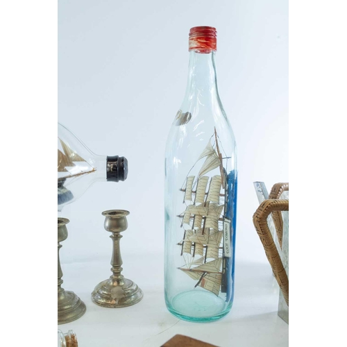 74 - A model of the sailing boat Ceres, in a Dimple bottle, labelled as purchased on a Honeymoon in Salco... 