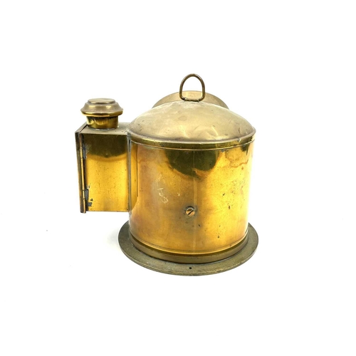 79 - A ship's brass binnacle compass, early 20th century, fitted with a side burner, height 25cm.