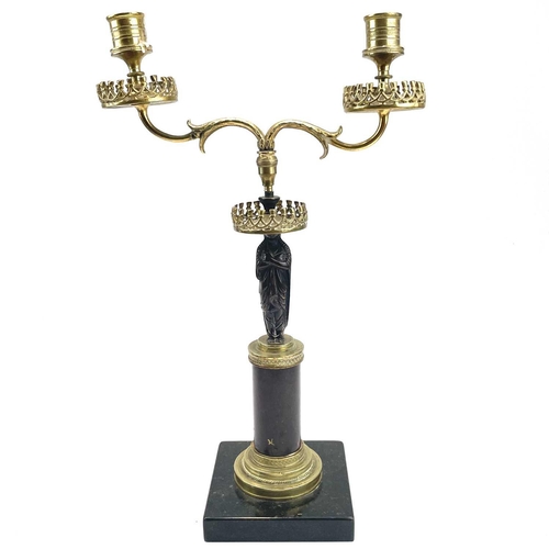 8 - A French bronze and ormolu figural candelabrum, circa 1900, with twin branches supported by a Classi... 