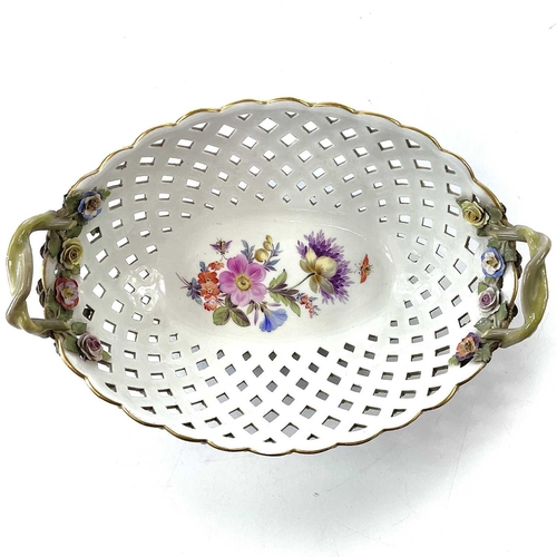 804 - A Meissen porcelain basket, late 19th century, with twin handles and with floral painted and encrust... 