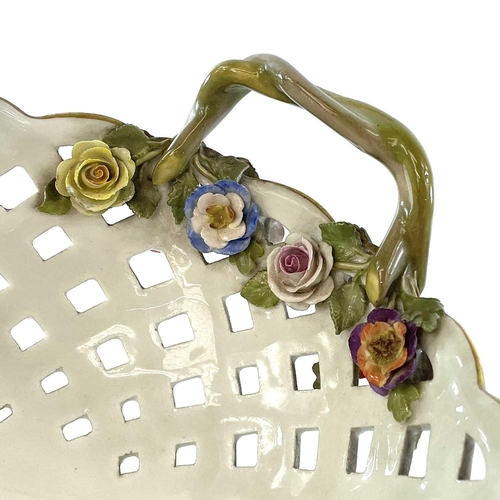 804 - A Meissen porcelain basket, late 19th century, with twin handles and with floral painted and encrust... 