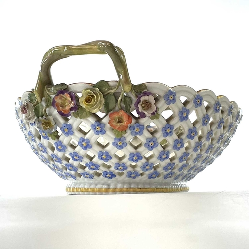 804 - A Meissen porcelain basket, late 19th century, with twin handles and with floral painted and encrust... 