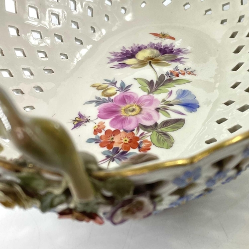 804 - A Meissen porcelain basket, late 19th century, with twin handles and with floral painted and encrust... 