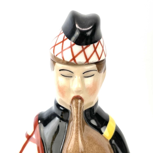 806 - An Art Deco Robj, Paris, porcelain decanter/flask and cover, modelled as a Scottish Bagpiper, height... 