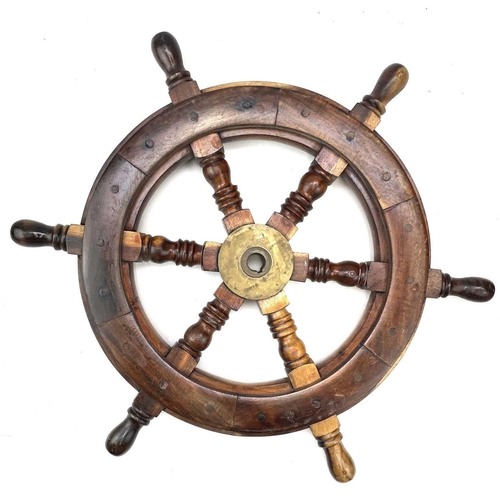 81 - A teak and brass yacht or ship's wheel, mid 20th century, with six turned spokes, diameter 51cm.