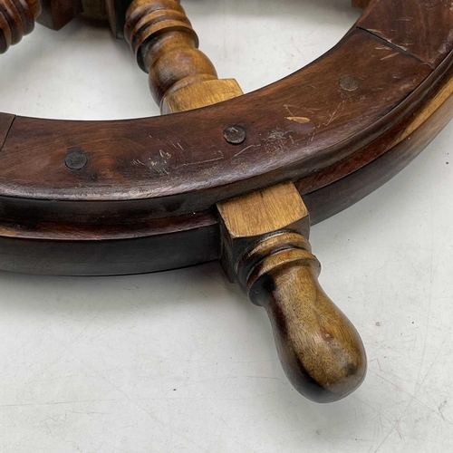 81 - A teak and brass yacht or ship's wheel, mid 20th century, with six turned spokes, diameter 51cm.