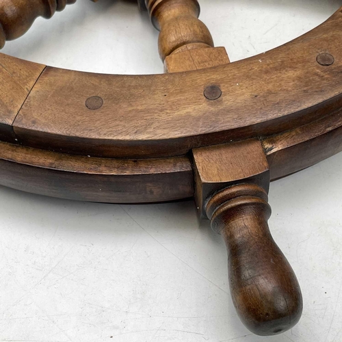 81 - A teak and brass yacht or ship's wheel, mid 20th century, with six turned spokes, diameter 51cm.